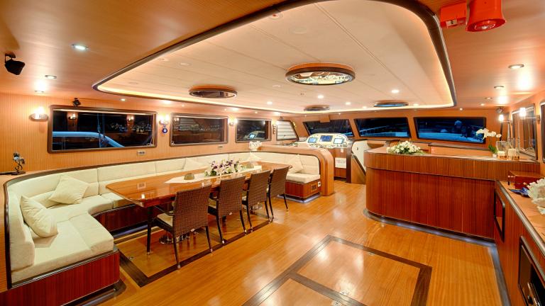 Comfortable and sophisticated furnishings on a luxury yacht.The light is on inside